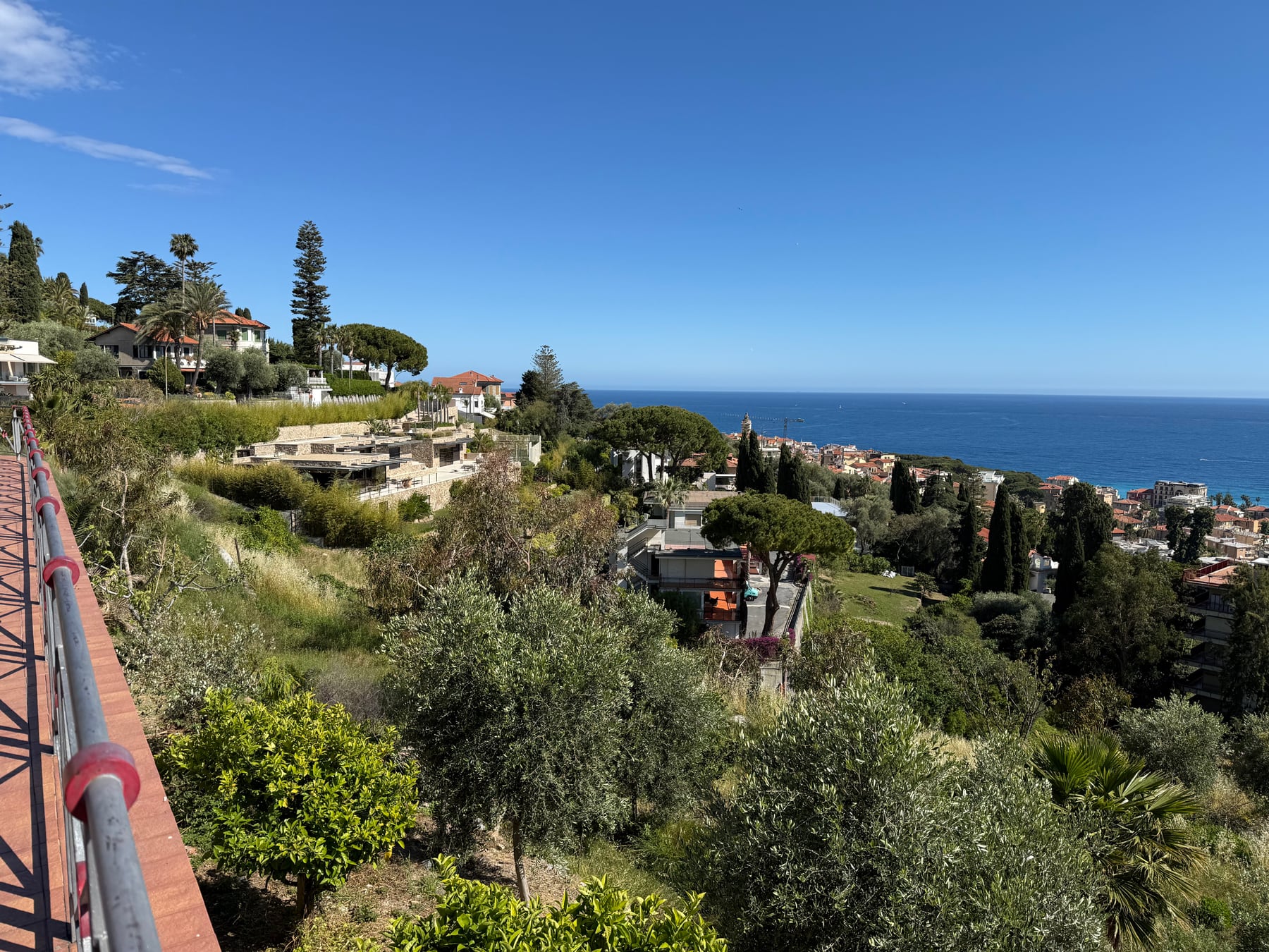 A sunny hillside view over Bordighera and the blue Mediterranean